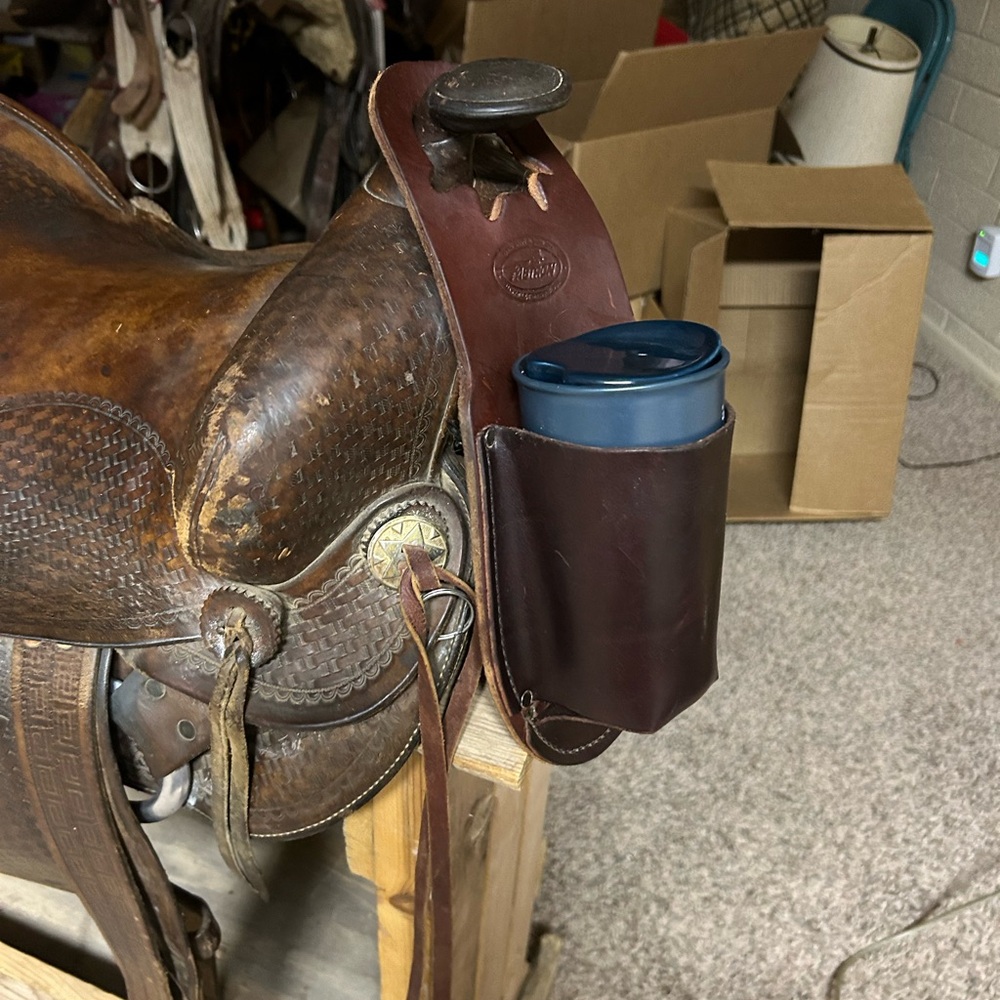 Leather saddle horn cup holder.